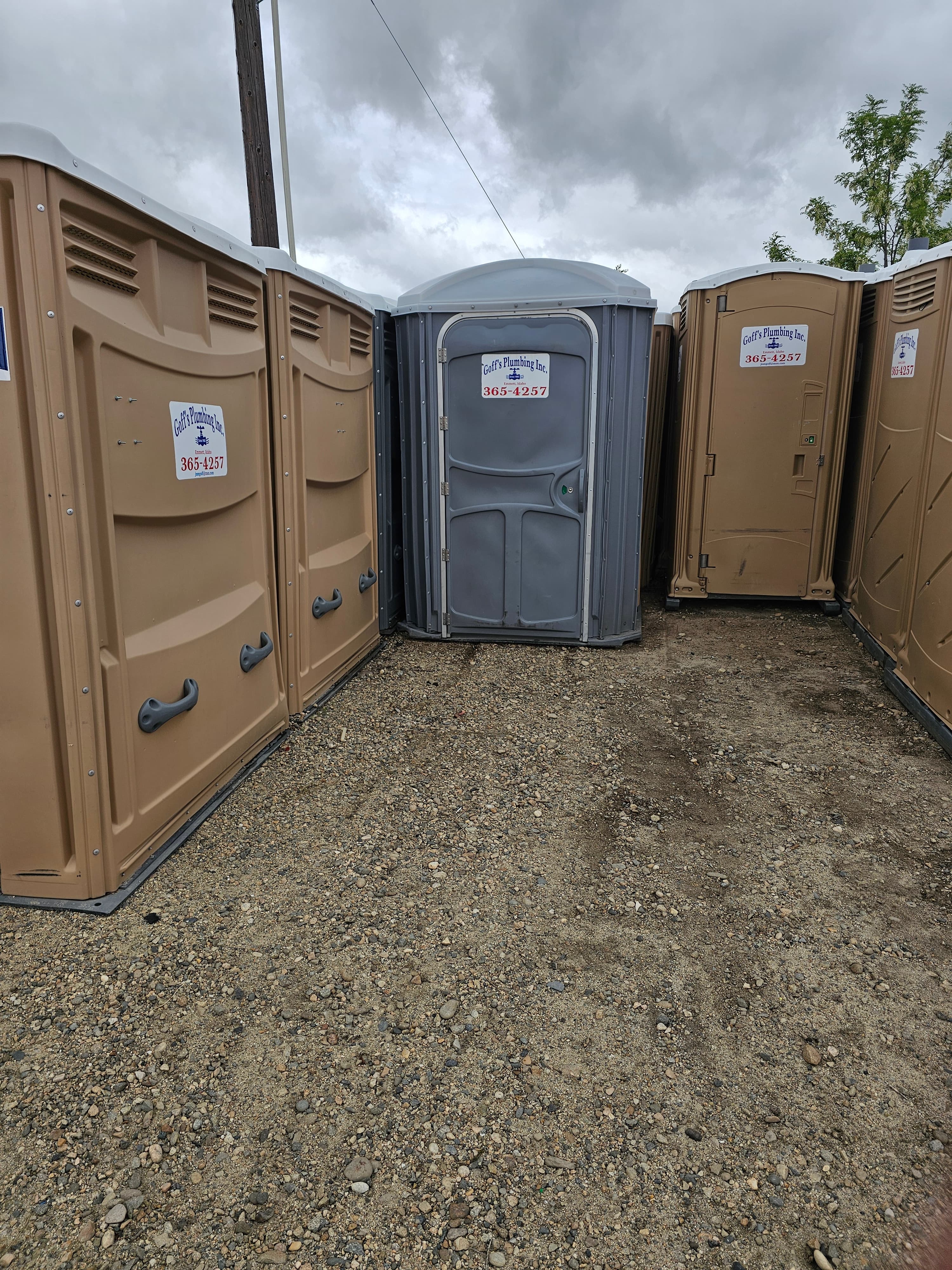 Gray portable toilet option commonly used for events and weddings.