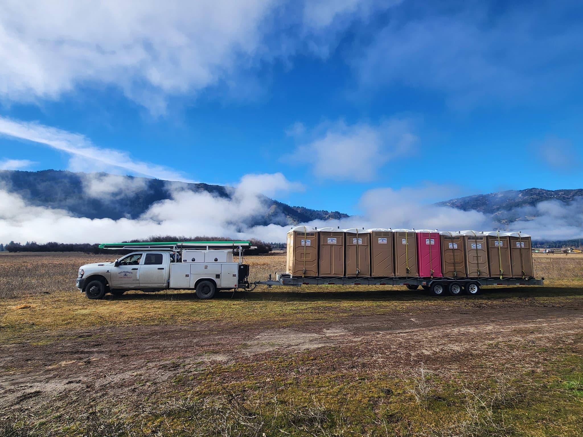 Goff's Plumbing, Inc. portable toilet lineup staged for delivery across the Emmett area.