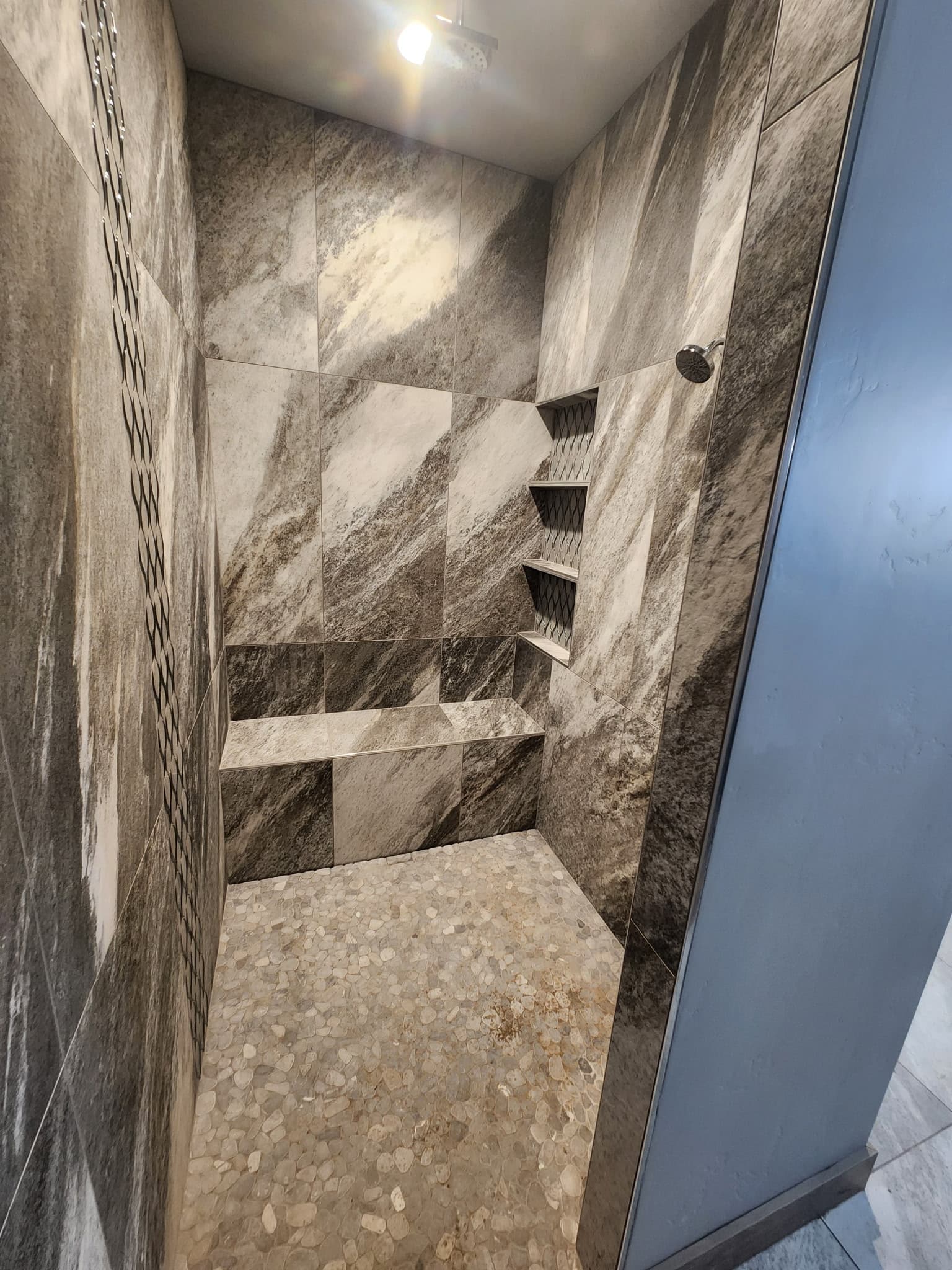 Completed shower fixture and finish plumbing detail.