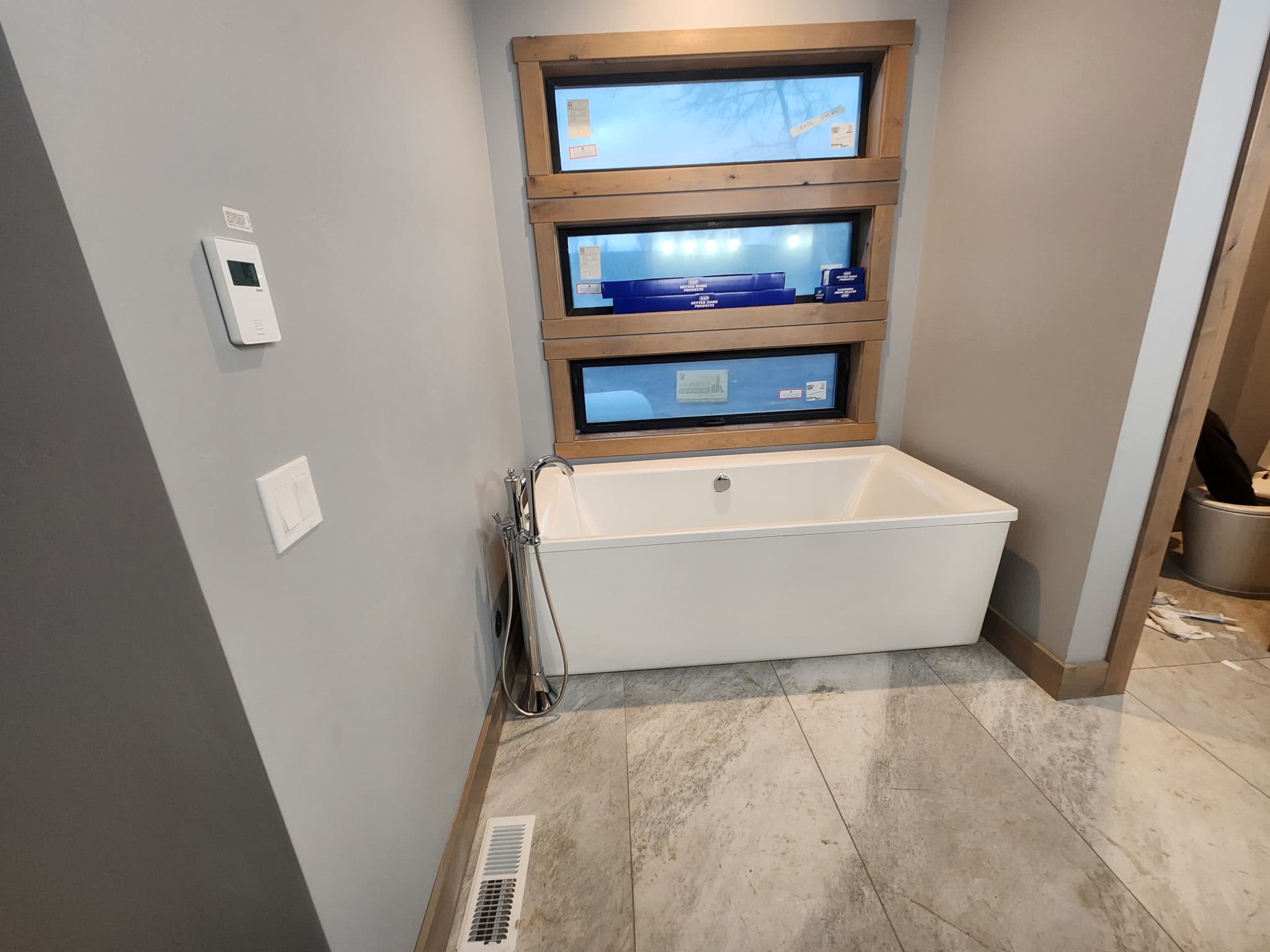 Tub installation and bathroom plumbing work.